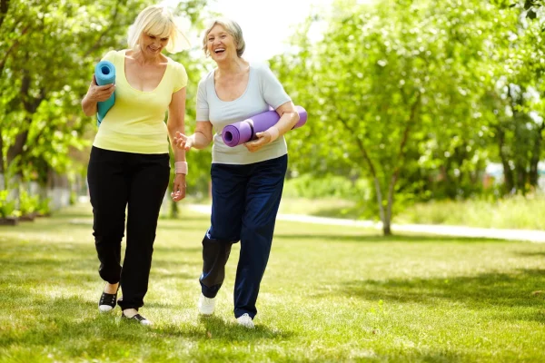 A group of people walking in the park, representing community bonding and the benefits of outdoor exercise