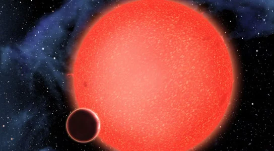 A planet undergoing geological transformation due to tidal heating forces from a red dwarf star