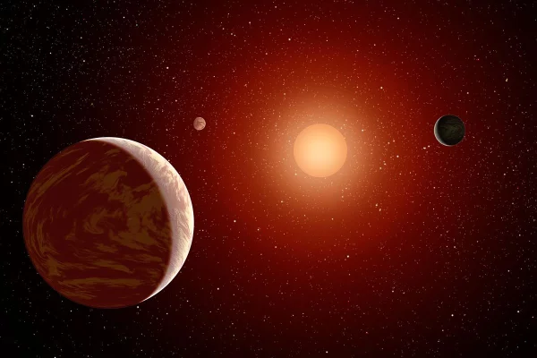 A red dwarf star and its orbiting planet, illustrating the habitable zone.