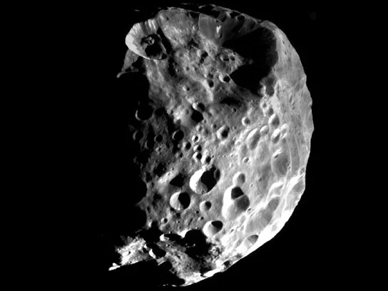 Image taken from the Cassini mission, showing Phoebe's nearly spherical shape.