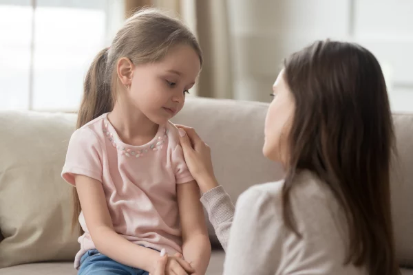 Parents and children discuss emotions after a tantrum