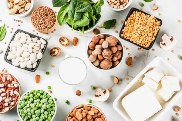 A balanced vegan meal featuring vegetables, seeds, and whole grains.